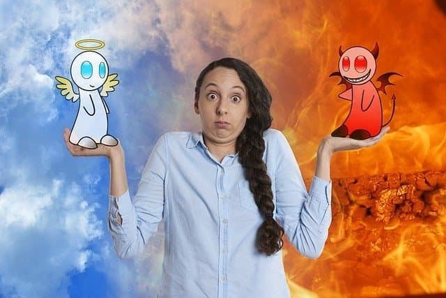 feature image for blog post"How to do things you don't want to do." Shows a woman shrugging with her hands held up, a devil sits on one palm and an angel on the other, symbolizing the difficult choice between productivity and procrastination.