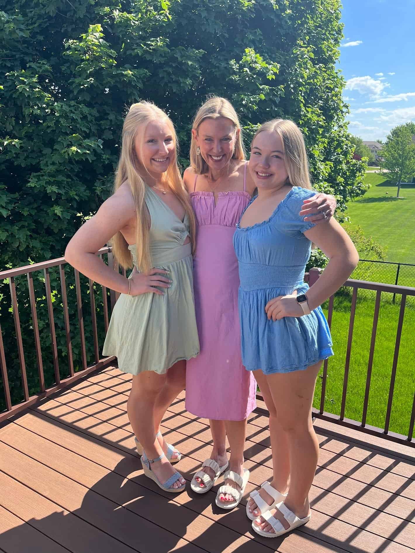 This Month's Name One Thing Interview, Dr Valerie Hoffman (and daughters) standing on a sunlight porch. This month's topic is advice for entering the job market.