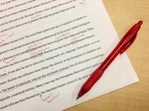 Personal statement being reviewed in red pen.