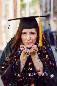 Graduation cap and gown for graduate student success and academic achievement.